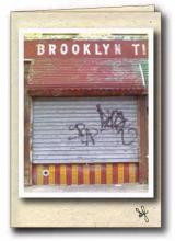 Brooklyn Tile storefront with graffiti
